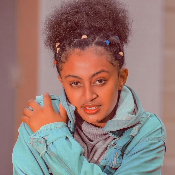 Avery Chen, Lead Design Curator at EverBalancedRoad, reviewing corporate floral arrangements